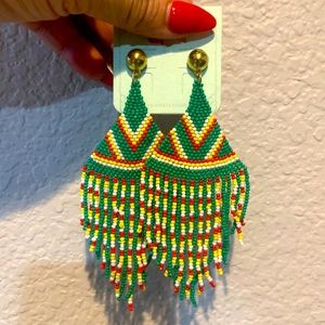 Delicately beaded, green dangling earrings